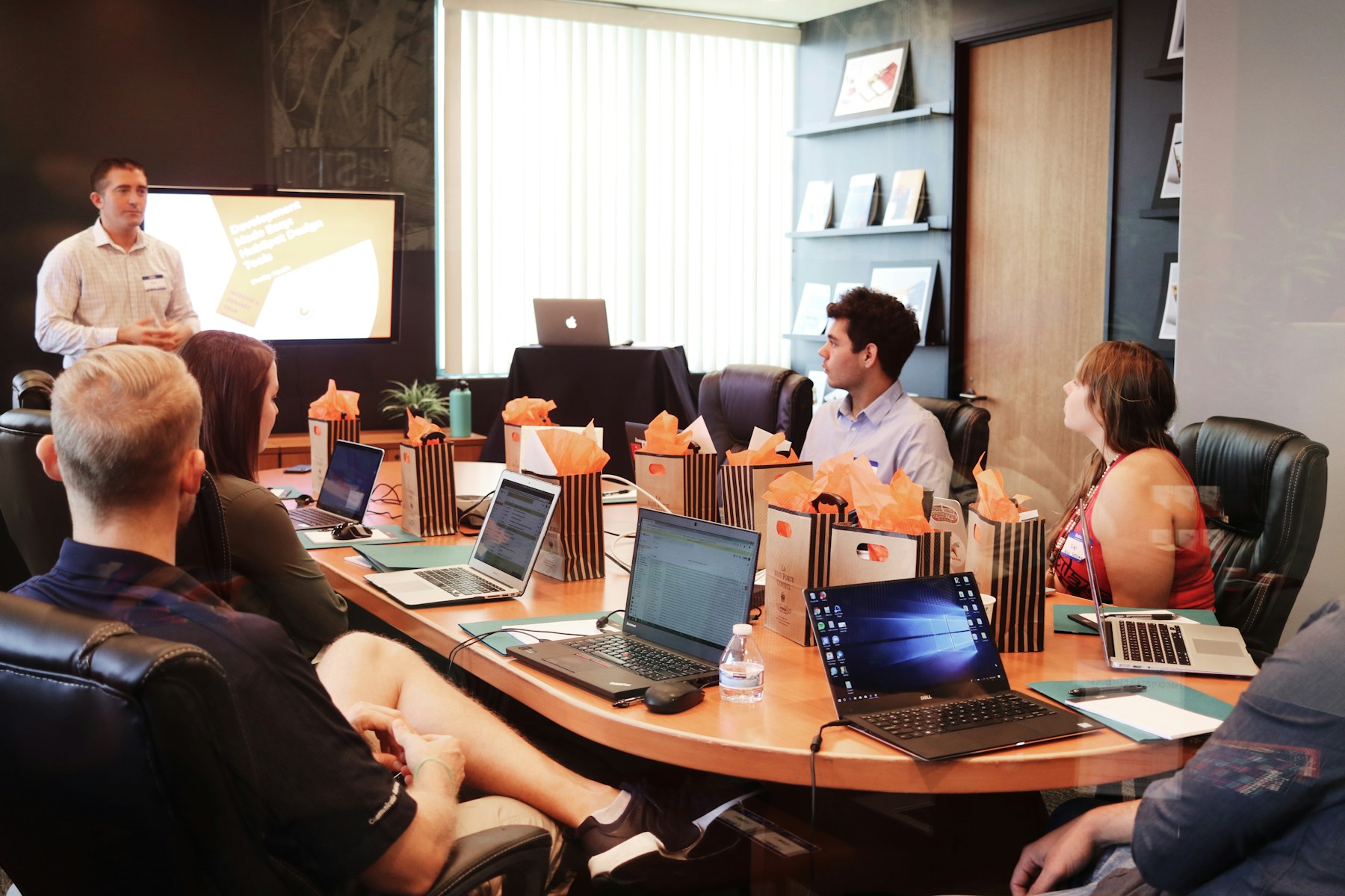 creative team gathered around printed work